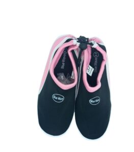 Lightweight beach shoes on sandy shore