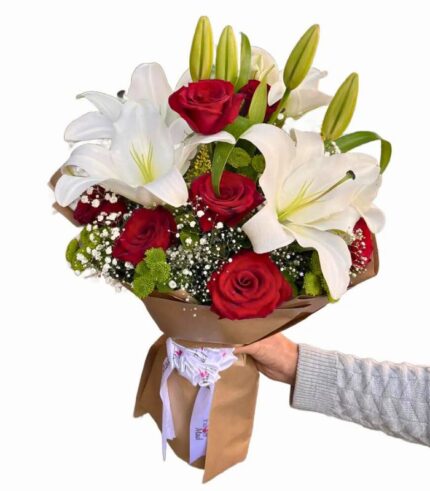 Romantic flower bouquet with red roses and white lilies