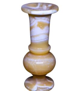 Side angle of Egyptian alabaster vase showing texture and depth