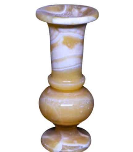 Side angle of Egyptian alabaster vase showing texture and depth