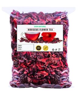 Dried hibiscus petals in a wooden bowl for herbal tea