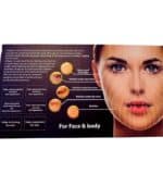 Woman applying 24K gold collagen serum on face