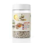 Supreme White Pepper whole peppercorns in a clear jar with wooden bowl and scoop